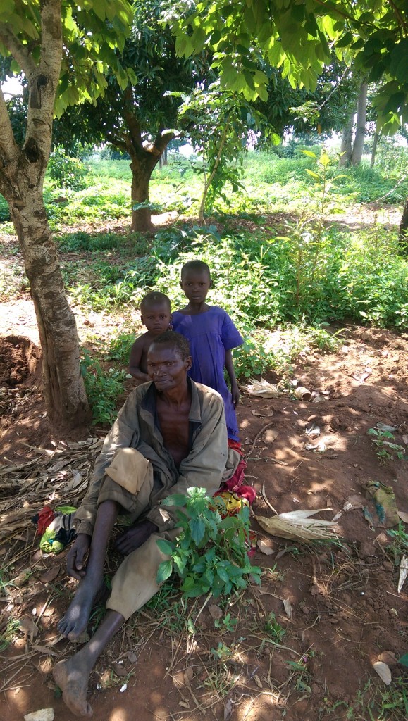 This is Simon's cousin and two of his children. They sleep seven in his hut. He was showing me a snake bite on his leg. Simon is disappointed his cousin refuses to send his children to the school Simon helped fund. He won't even take a tour of it.